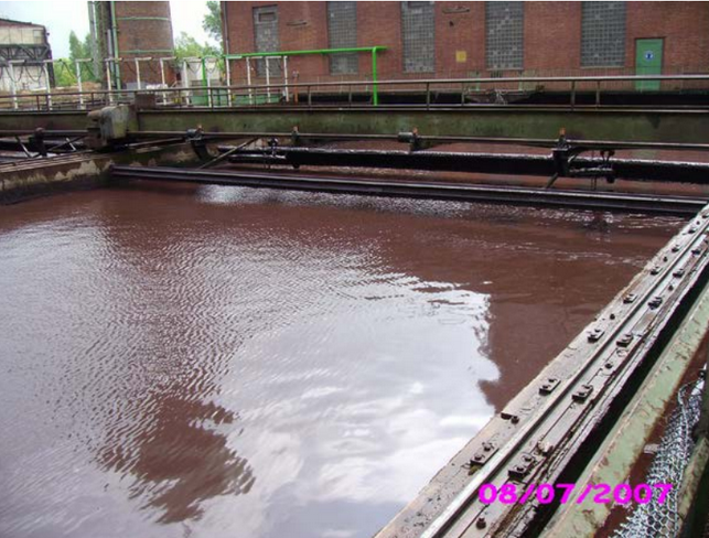 Long clarifier tank with oil skimmer.